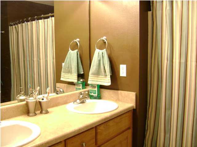 24270 Mcphail Farm Road Florala, AL 36442 - Photo 8 of 25 a bathroom with a double vanity sink and a mirror