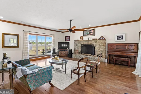 a living room with furniture and a fireplace