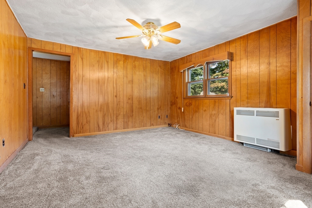 52 Brooks Street Maynard, MA 01754 - Photo 14 of 28 an empty room with windows and cabinet