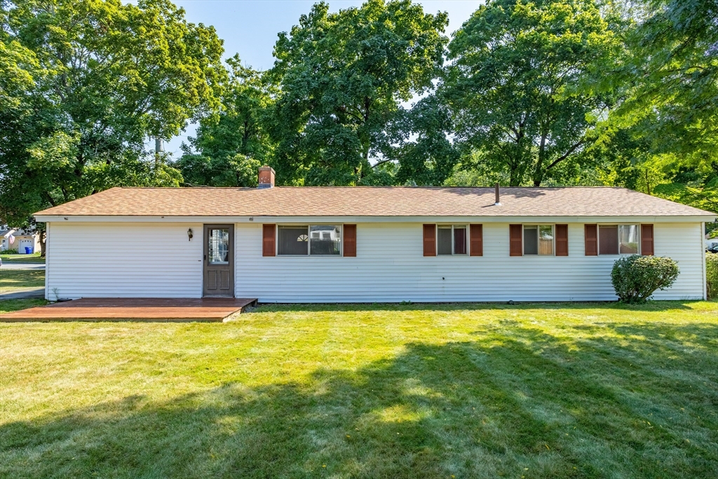 52 Brooks Street Maynard, MA 01754 - Photo 22 of 28 a front view of a house with a yard