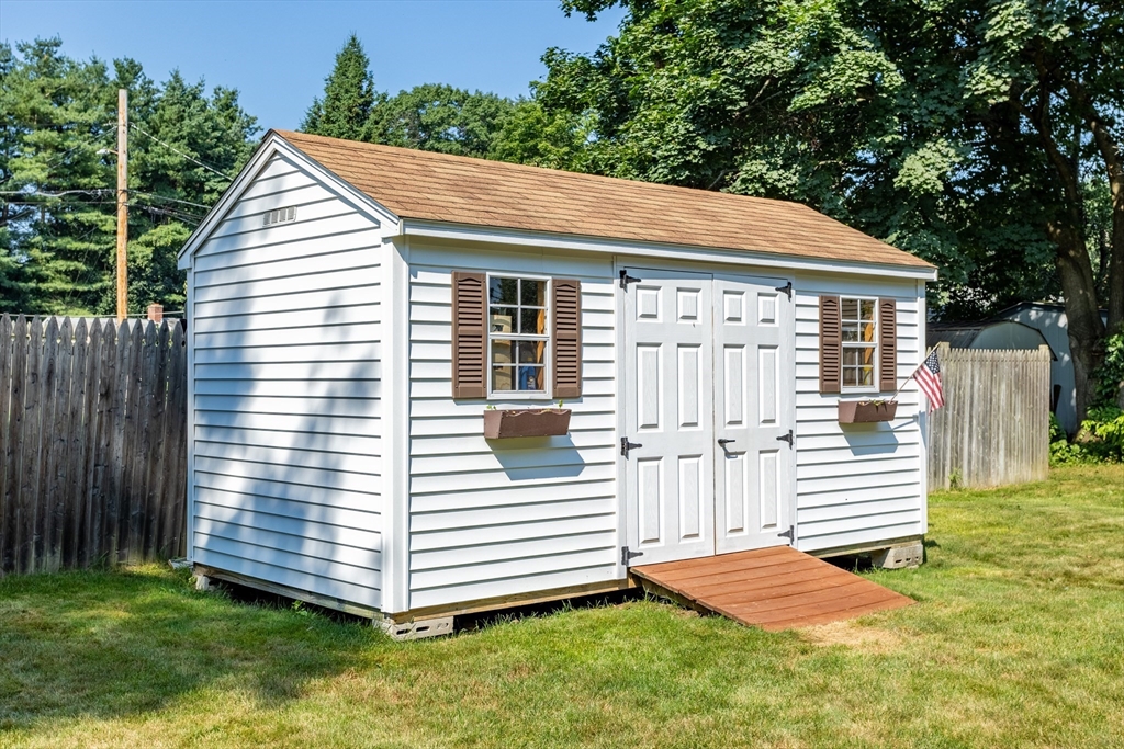 52 Brooks Street Maynard, MA 01754 - Photo 26 of 28 a view of a house with a yard