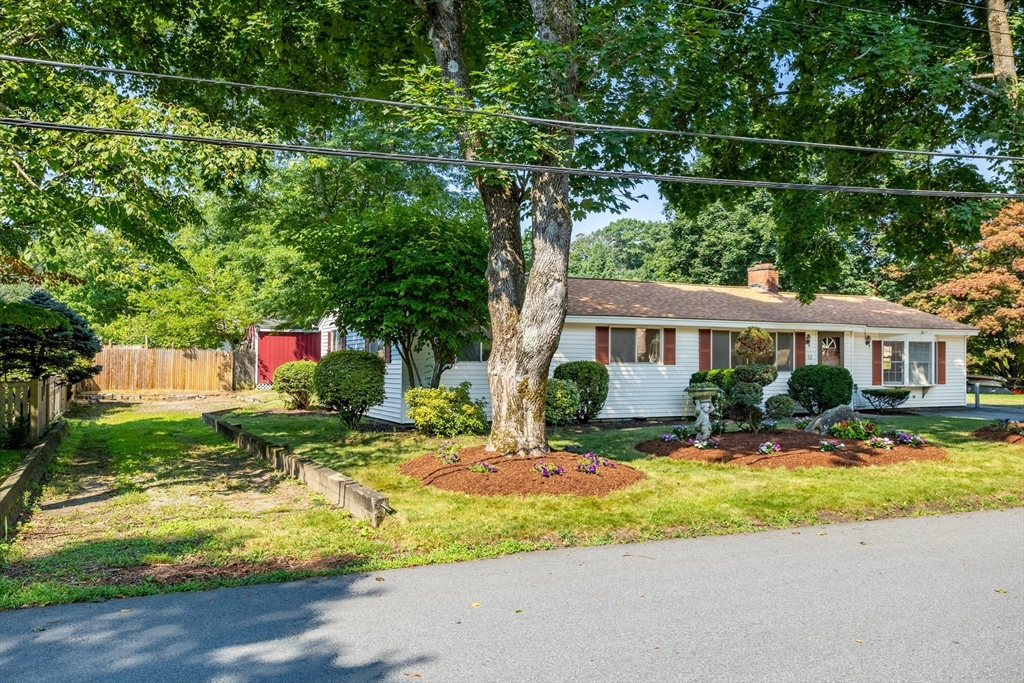 52 Brooks Street Maynard, MA 01754 - Photo 27 of 28 a front view of house with yard and green space
