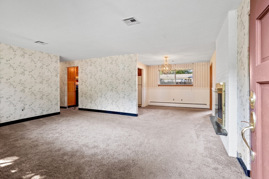 52 Brooks Street Maynard, MA 01754 - Photo 3 of 28 a view of an empty room with a window