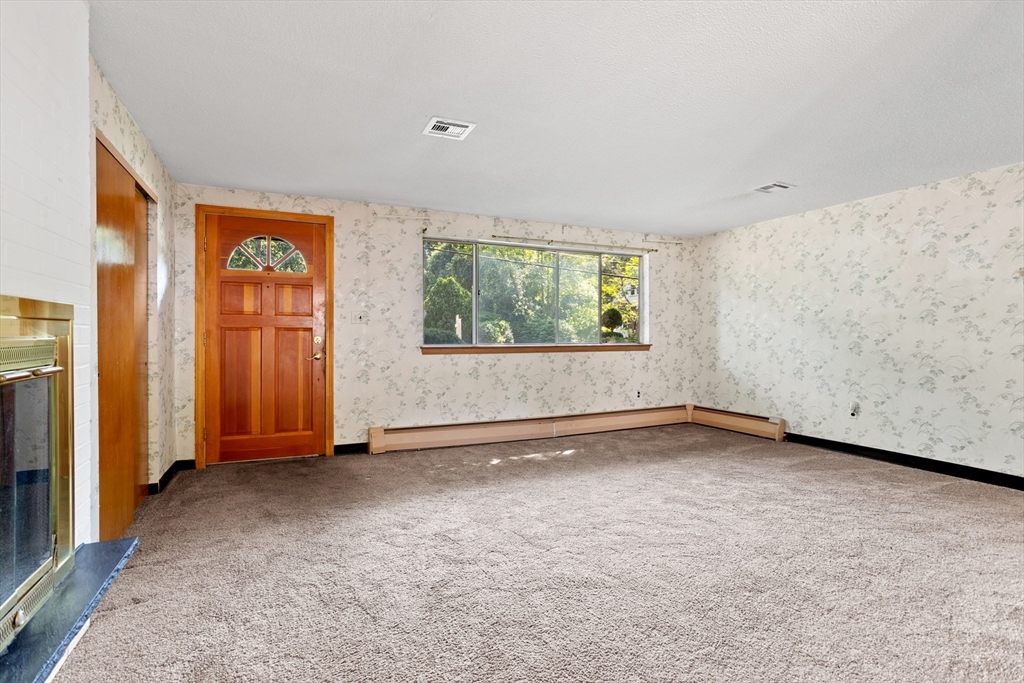 52 Brooks Street Maynard, MA 01754 - Photo 6 of 28 an empty room with windows