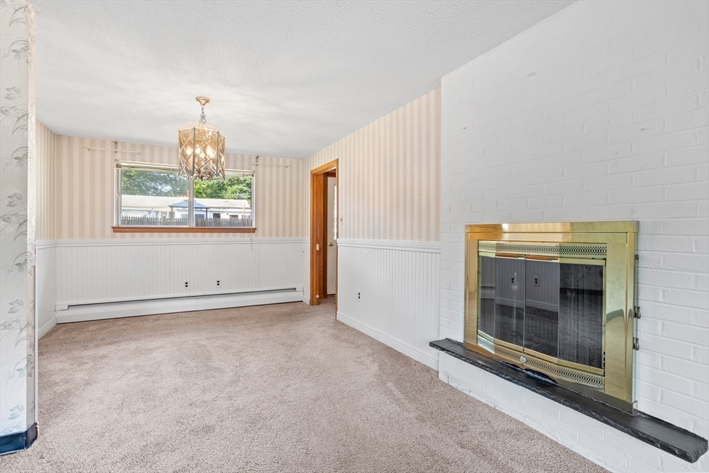 52 Brooks Street Maynard, MA 01754 - Photo 7 of 28 a view of an empty room with a window