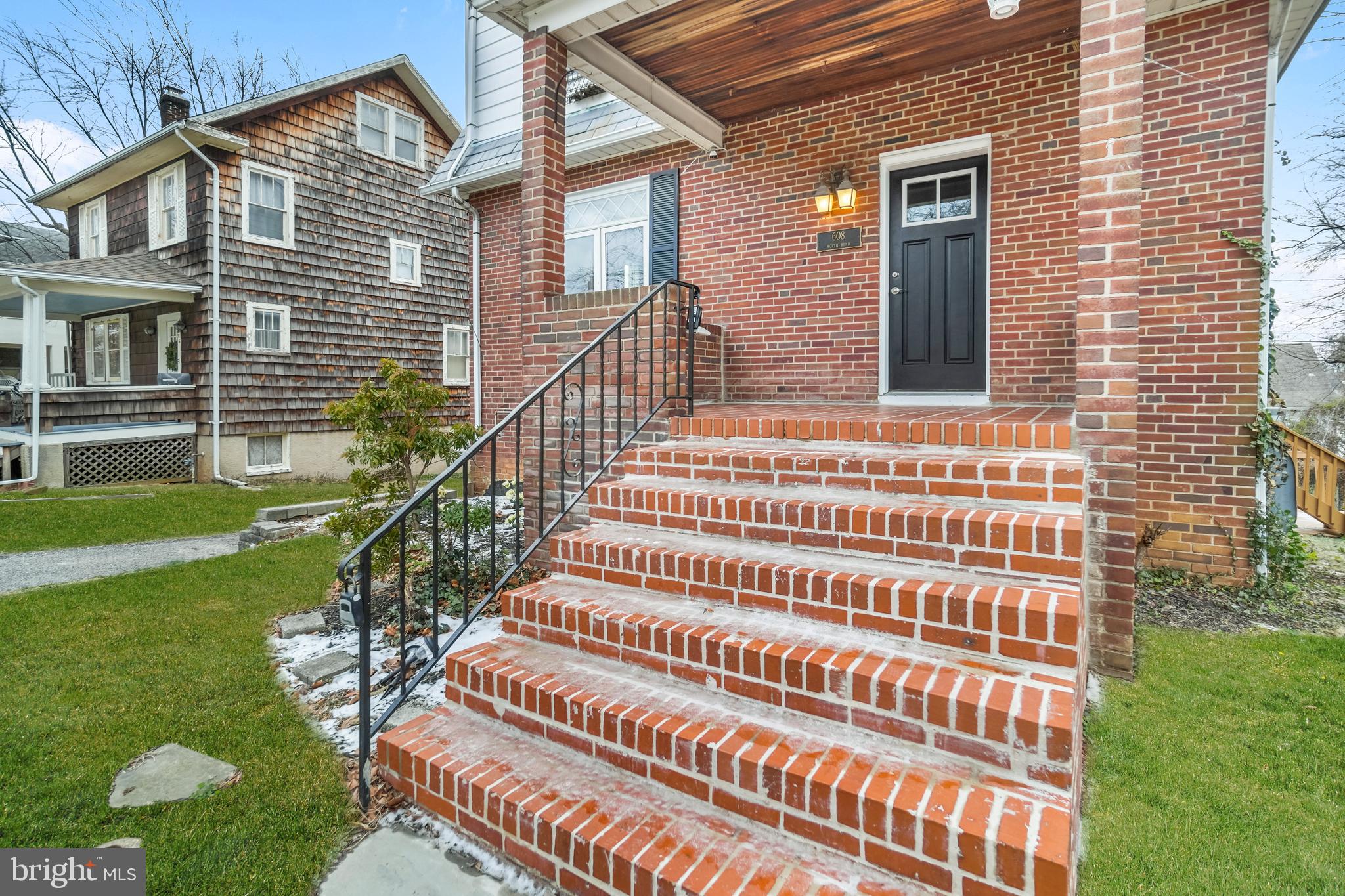 608 North Bend Road Baltimore, MD 21229 - Photo 4 of 31 brick steps lead to ceramic tile covered porch