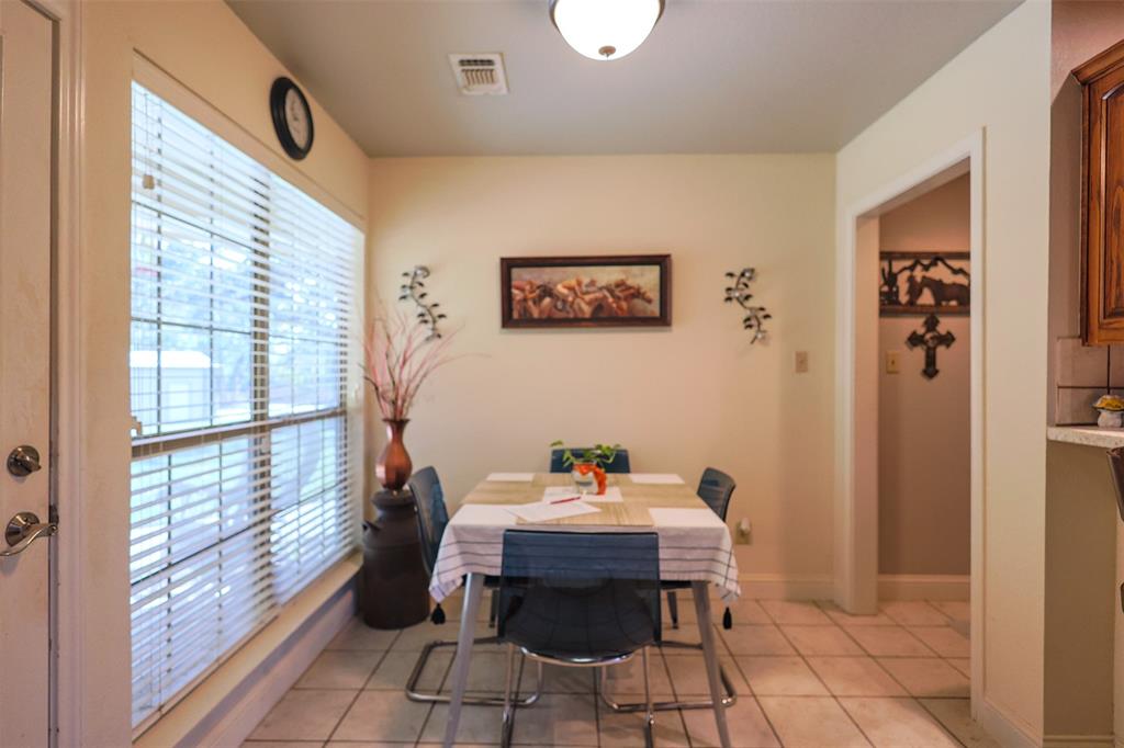111 Deerfield Road Paradise, TX 76073 - Photo 12 of 39 Dining space with light tile patterned flooring and baseboards