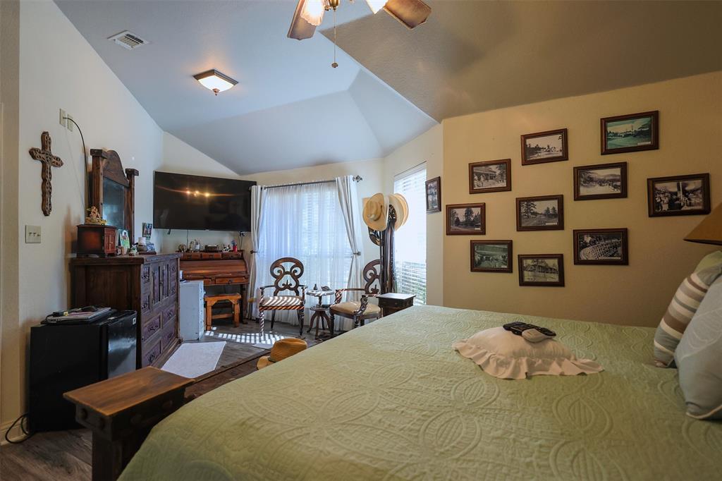 111 Deerfield Road Paradise, TX 76073 - Photo 16 of 39 Bedroom with lofted ceiling, ceiling fan, and wood finished floors