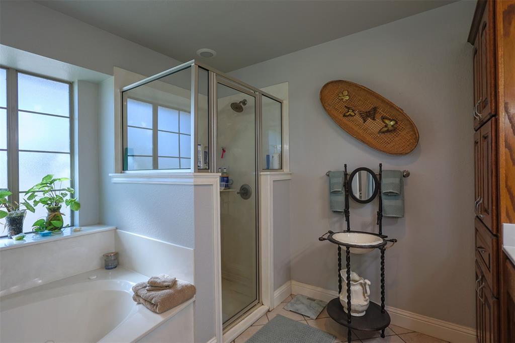 111 Deerfield Road Paradise, TX 76073 - Photo 18 of 39 Full bath with light tile patterned floors, a bath, and a shower stall