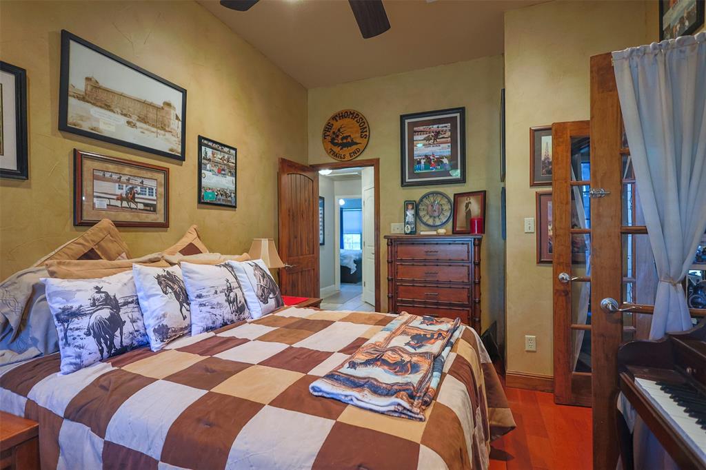 111 Deerfield Road Paradise, TX 76073 - Photo 19 of 39 Bedroom featuring wood finished floors and ceiling fan