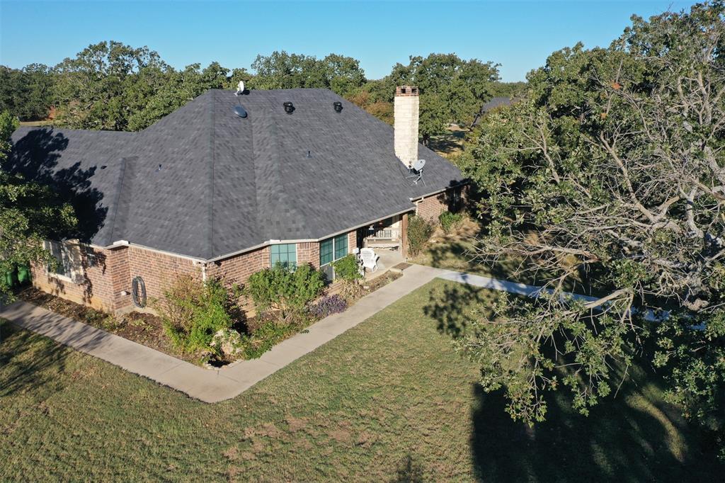 111 Deerfield Road Paradise, TX 76073 - Photo 24 of 39 View from above of property featuring a tree filled landscape