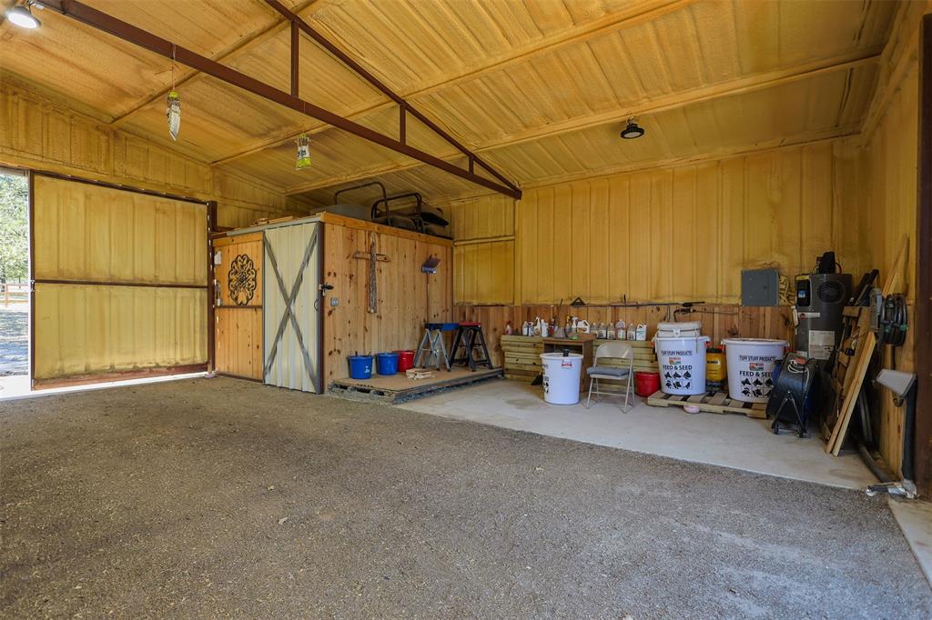 111 Deerfield Road Paradise, TX 76073 - Photo 30 of 39 Garage with wooden walls