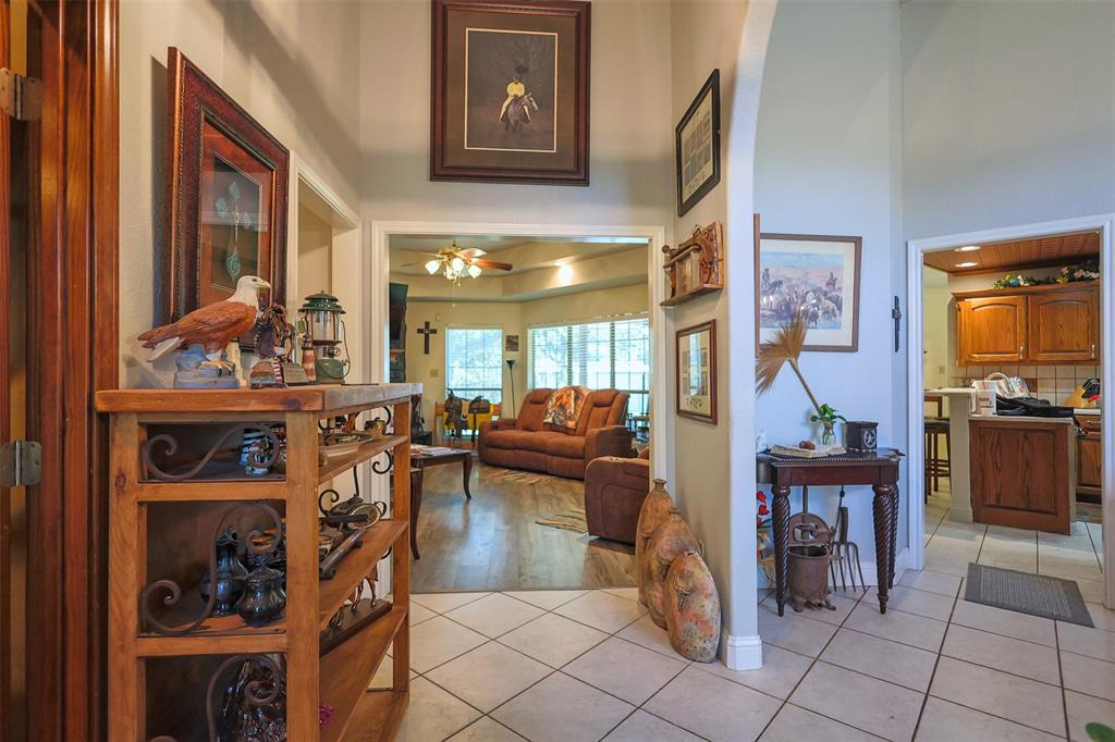 111 Deerfield Road Paradise, TX 76073 - Photo 7 of 39 Hall with light tile patterned flooring and a towering ceiling