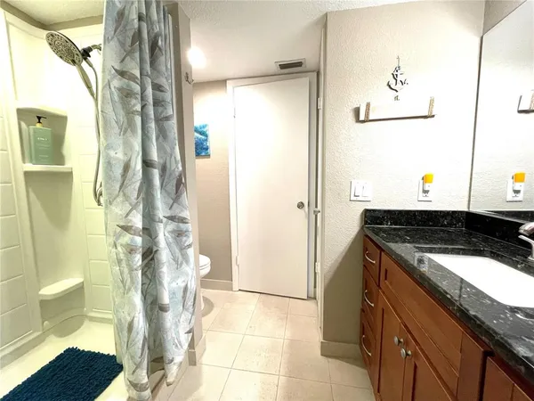 a kitchen with a refrigerator and a stove