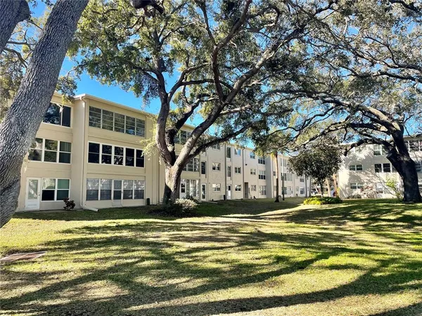 a view of building with trees in the background