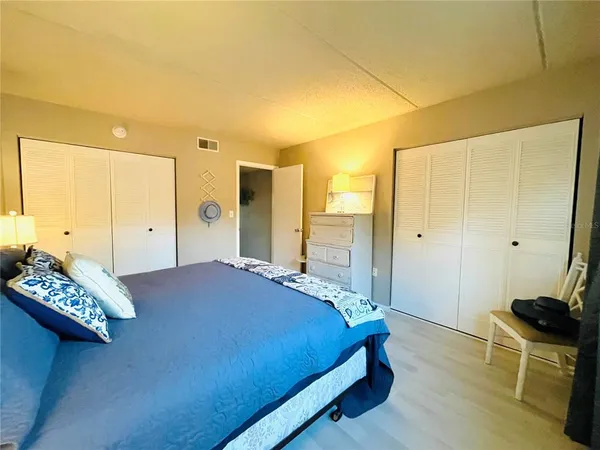 a bedroom with a bed and a table in it