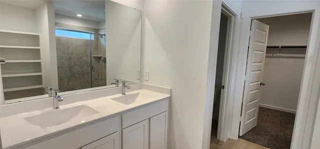 a bathroom with a sink and a mirror