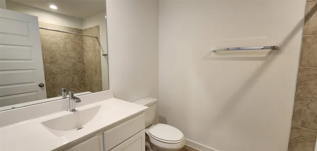 a bathroom with a white sink and a shower