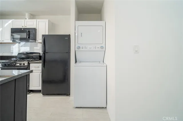 a kitchen with a refrigerator a stove and a refrigerator