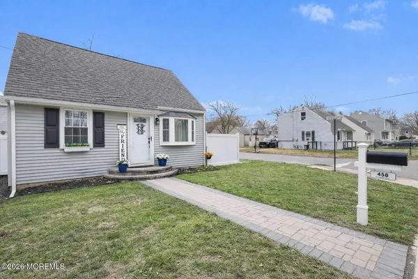 a view of a yard in front of a house with garage