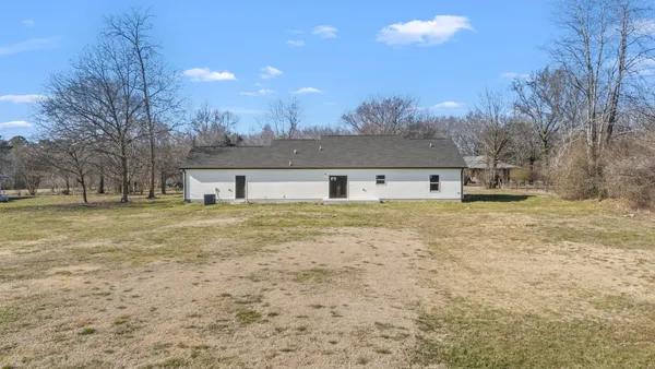 a front view of a house with a yard and a garage