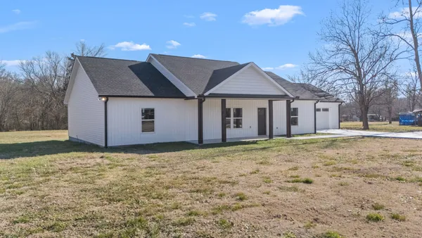 a house with yard in front of it