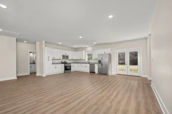 a view of a kitchen with wooden floor