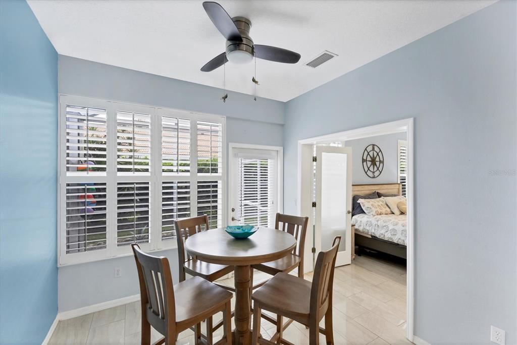 640 Back 9 Drive Venice, FL 34285 - Photo 11 of 54 a view of a dining room with furniture and window
