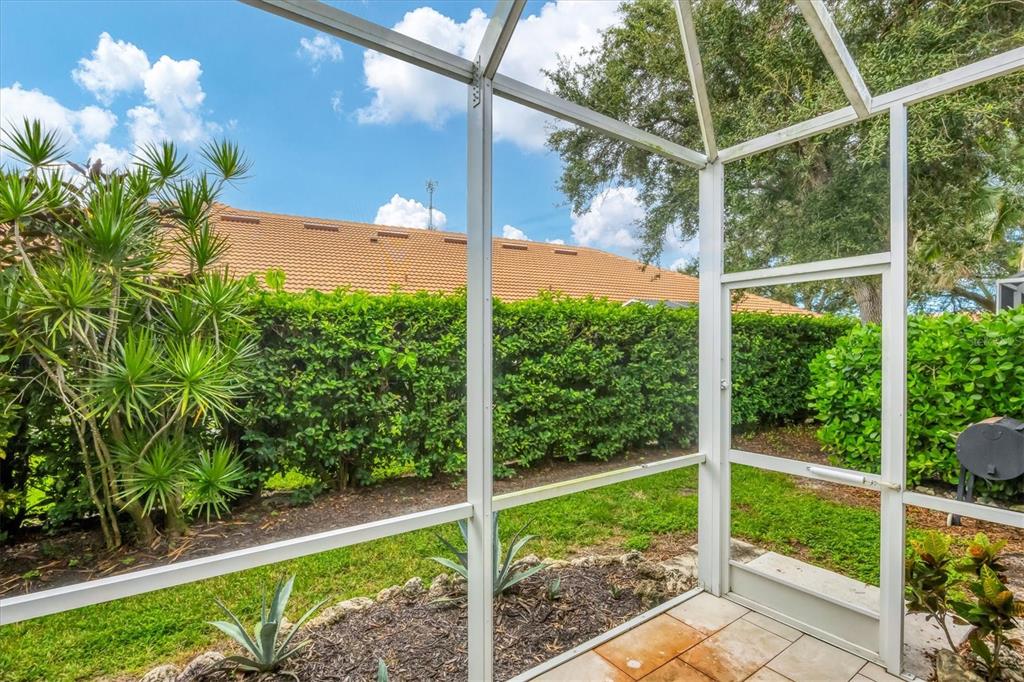 640 Back 9 Drive Venice, FL 34285 - Photo 16 of 54 a view of a yard in front of a yard with potted plants