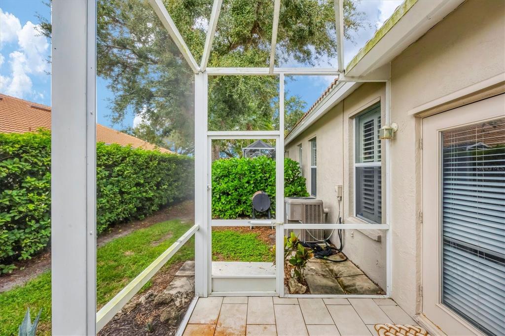 640 Back 9 Drive Venice, FL 34285 - Photo 17 of 54 a view of a porch with furniture and garden