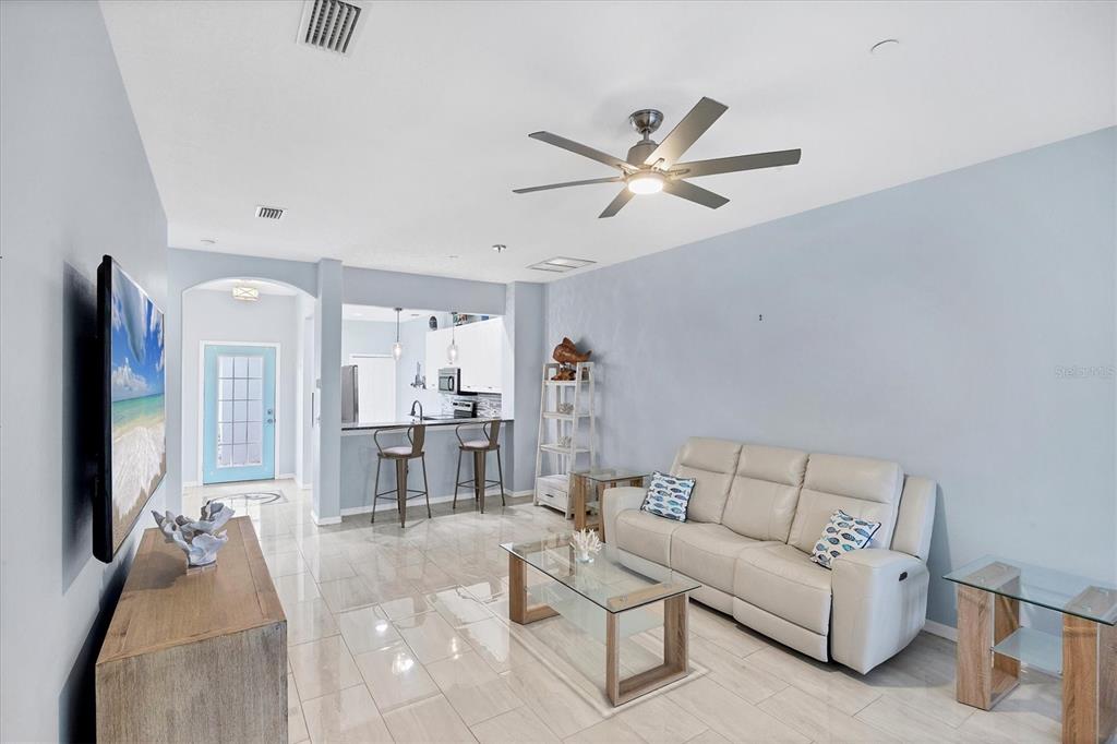 640 Back 9 Drive Venice, FL 34285 - Photo 22 of 54 a living room with furniture and a flat screen tv