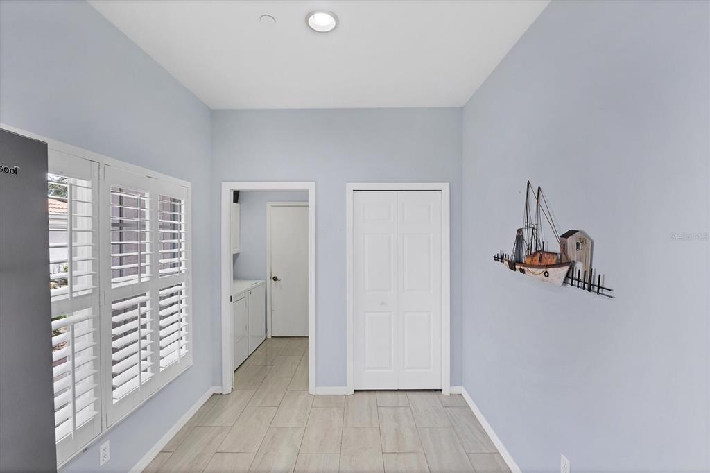 640 Back 9 Drive Venice, FL 34285 - Photo 32 of 54 a view of a room with walk in closet and wooden floor