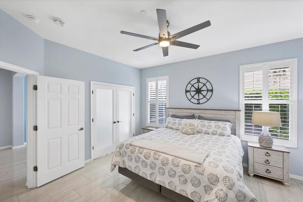 640 Back 9 Drive Venice, FL 34285 - Photo 38 of 54 a bedroom with a large bed and a window