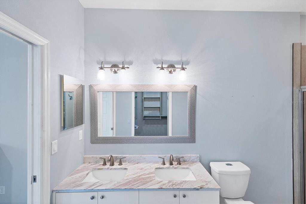 640 Back 9 Drive Venice, FL 34285 - Photo 44 of 54 a bathroom with a sink and a mirror