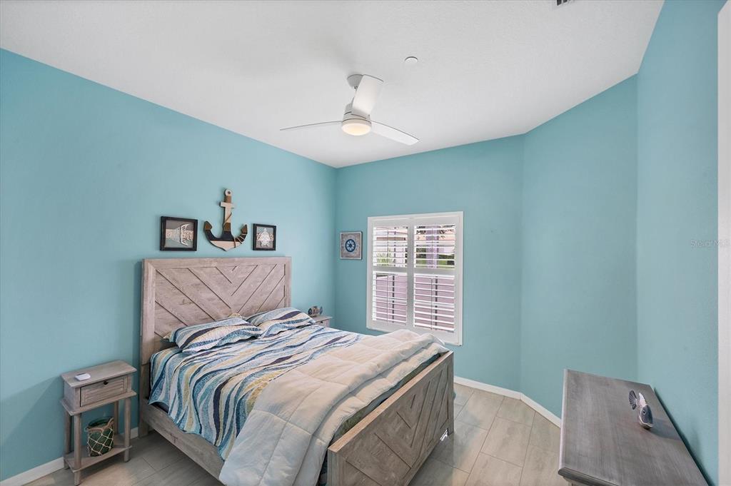 640 Back 9 Drive Venice, FL 34285 - Photo 48 of 54 a bedroom with a large bed and a window