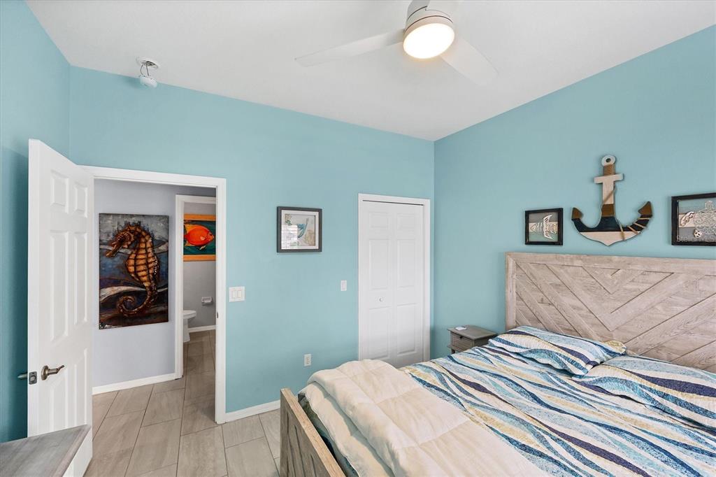 640 Back 9 Drive Venice, FL 34285 - Photo 50 of 54 a bedroom with a bed and a wooden floor