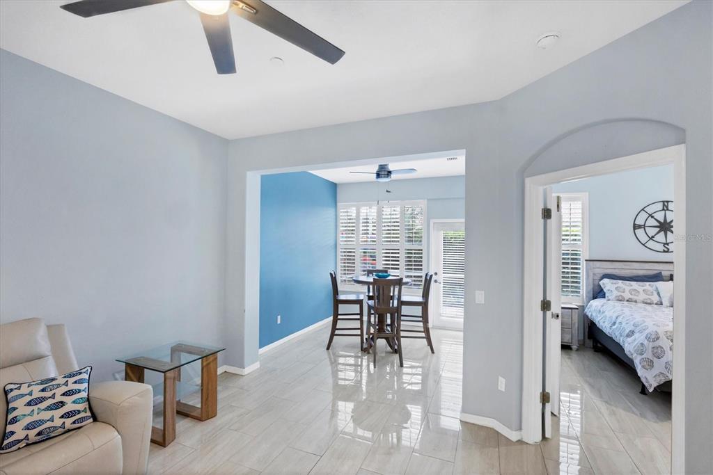 640 Back 9 Drive Venice, FL 34285 - Photo 8 of 54 a view of a livingroom with furniture and a ceiling fan