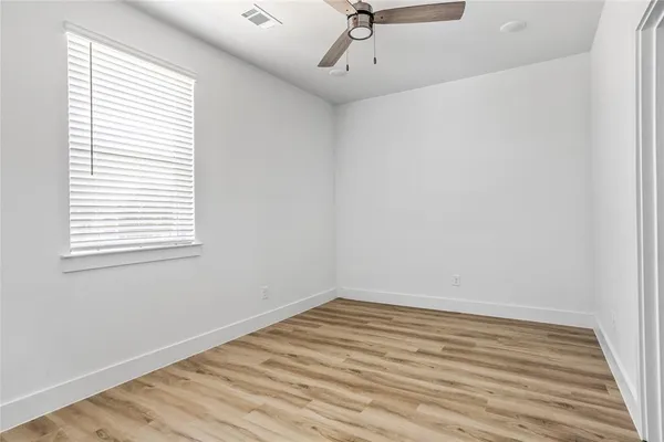a view of an empty walk in closet