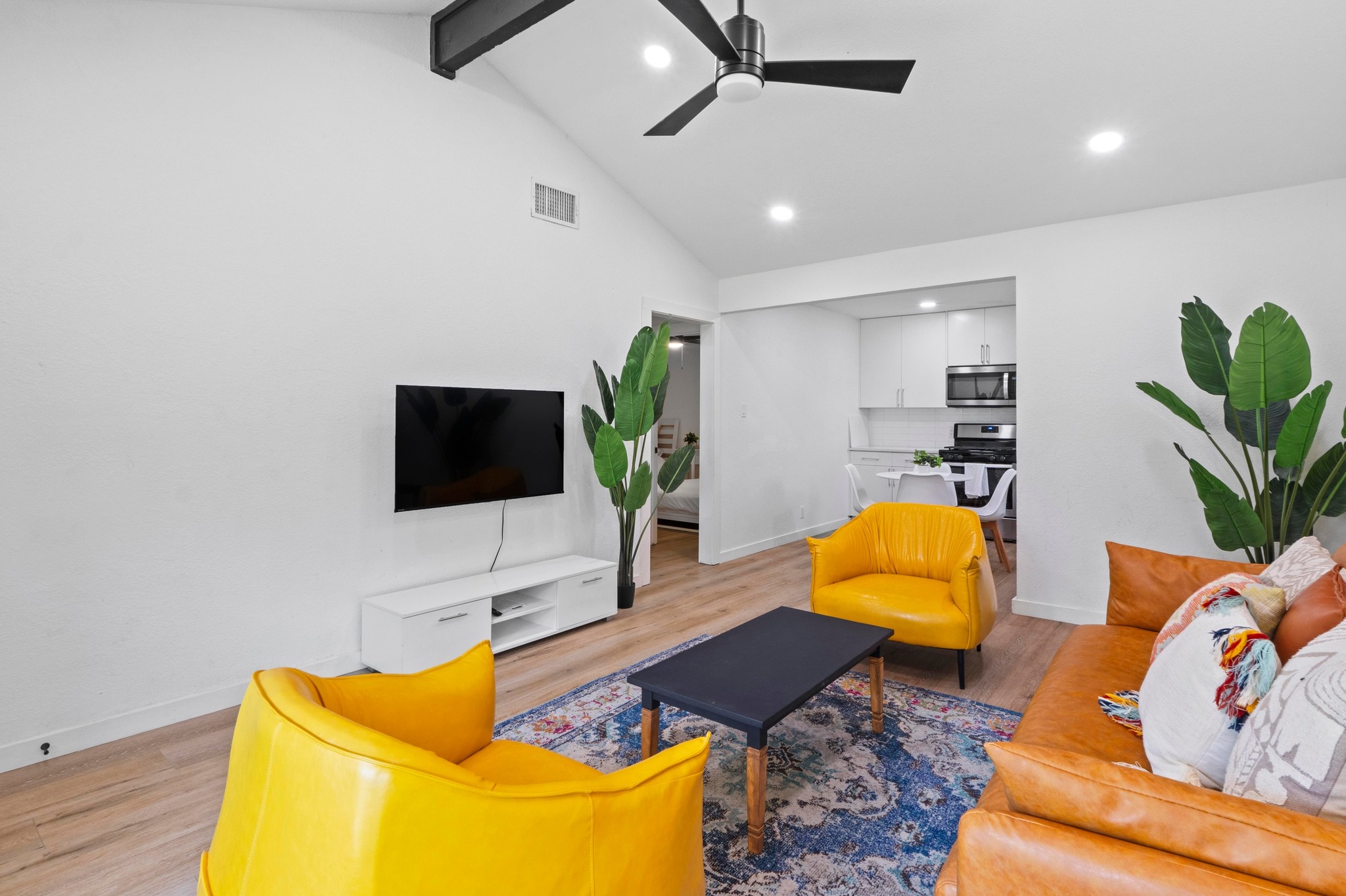 10601 Macmora Road, Unit B Austin, TX 78758 - Photo 5 of 22 Vast vaulted ceilings create an open, airy atmosphere in this inviting living space.