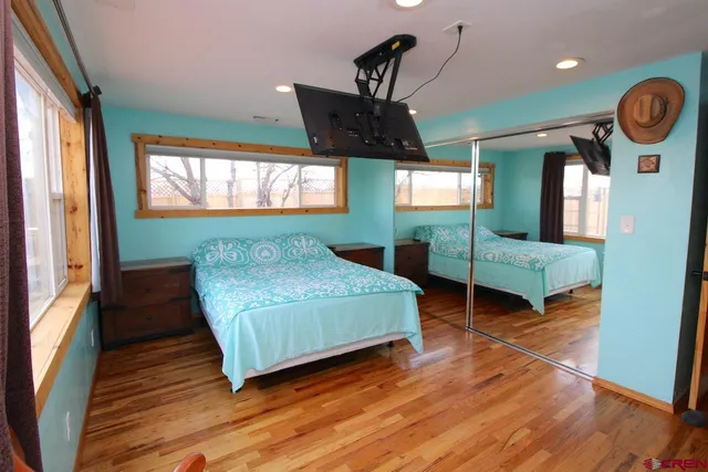 a bedroom with bed and window