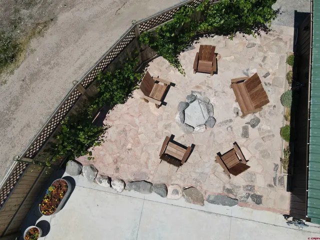 an aerial view of a house with backyard
