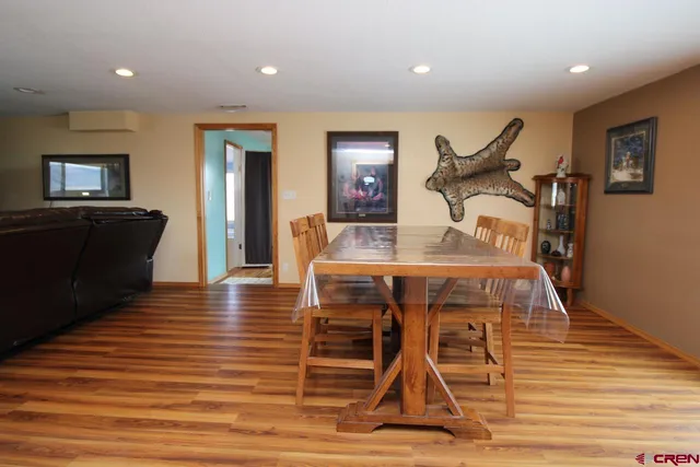 a view of a livingroom with furniture and wooden floor