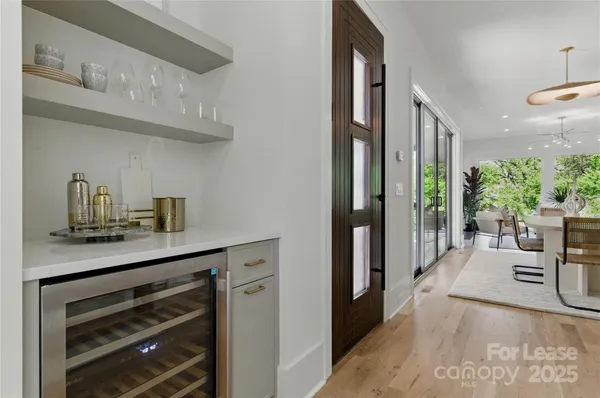 a living room with furniture and potted plant