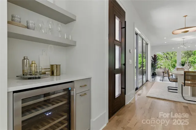 a living room with furniture and potted plant