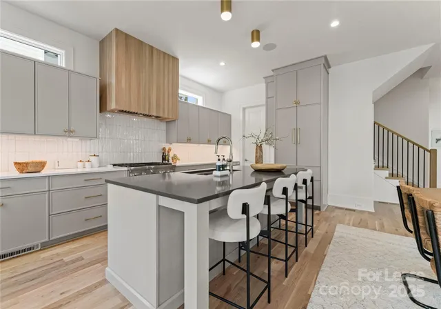 a kitchen with appliances cabinets and a sink