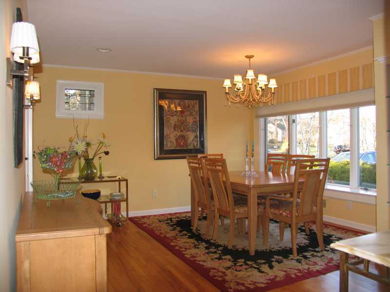 14 Bonwit Road Riverside, CT 06878 - Photo 6 of 13 a dining room with furniture a rug and a chandelier