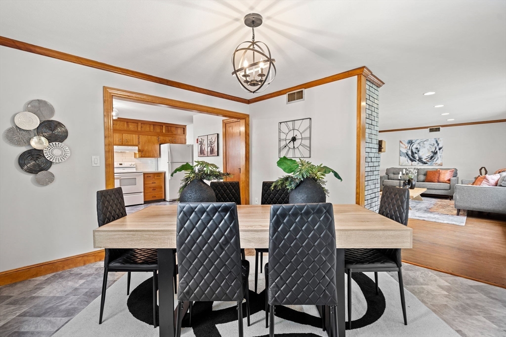 58 Spring Street Wakefield, MA 01880 - Photo 14 of 41 a view of a dining room with furniture window and wooden floor