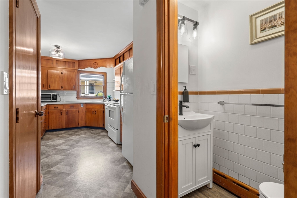 58 Spring Street Wakefield, MA 01880 - Photo 15 of 41 a bathroom with a sink a toilet and shower