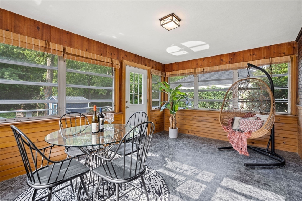 58 Spring Street Wakefield, MA 01880 - Photo 16 of 41 a dining room with furniture and a floor to ceiling window