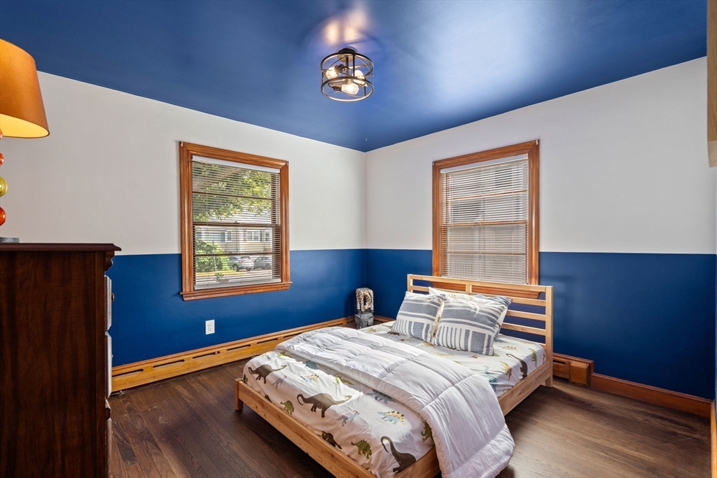 58 Spring Street Wakefield, MA 01880 - Photo 21 of 41 a bedroom with a bed and a window